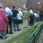 A line of voters waiting to be let in to the polling station at 7:03 AM at Good Will Baptist Church in Adams Morgan at Columbia and Kalorama Rd, NW.