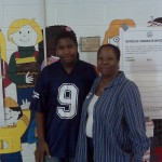 Andrew Green, age 15, with his mother, Helen Green at Hendley Elementary at 600 Chesapeake St, SE at 10:20 AM. Both Ms. Green and her son are election day workers; Andrew is a volunteer.
