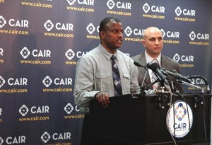 Mohamed Salim, left, talks with reporters. Photo courtesy of the Council on America-Islamic Relations